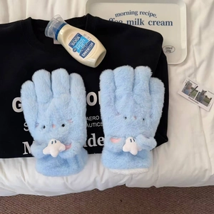 Close-up of light blue plush gloves featuring cartoon embroidery and soft faux fur texture