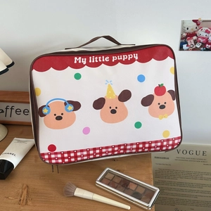 Detail view of cartoon dog print storage bag with cosmetics and makeup accessories