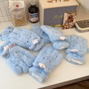 Detail of plush cat themed gloves in light blue with soft embroidery and cozy lining