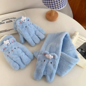 Detail of plush blue faux fur winter set featuring cute bear design and star embroidery