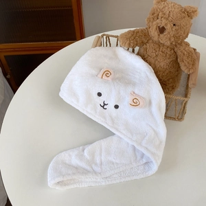 Detail of cute lamb embroidery on ultra-absorbent white coral fleece hair towel wrap