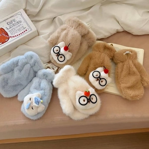 Detail of plush cat gloves featuring cute glasses and decorative strawberry crown accents