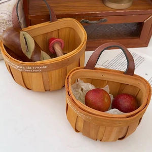 Nordic woven wood storage baskets with leather handles and French vintage decor
