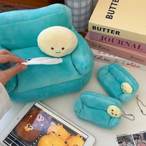 Detail of plush sofa tissue box and mini pendant set in soft cyan velvet fabric