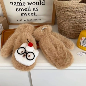Detail of plush brown mittens featuring a cute glasses bear applique and red cherry accent