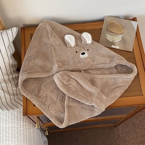 Detail of soft brown coral fleece hair towel with cute embroidered bear ears