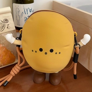Detail view of the yellow cartoon potato bag with fun boxing glove arms and woven strap