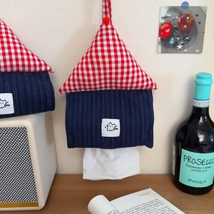 Detail of wall-mounted tissue box holder with house shape and cute cat patch decoration