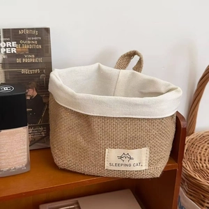 Hanging jute woven basket for kitchen storage featuring a cute cat patch and cotton liner
