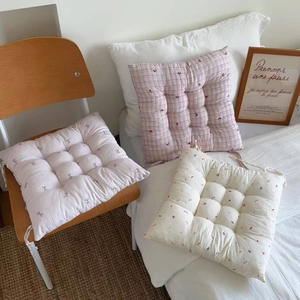 Quilted floral chair cushions with ties in pink plaid and bow patterns for office chairs