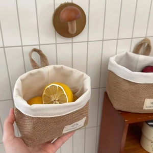 Detail of hand-woven jute storage basket with cotton lining and durable handle