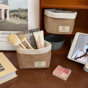 Dual-pack of woven jute storage baskets with linen lining and Sleeping Cat patch