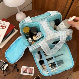 Blue plaid vanity bag with multi-functional compartments and brush slots for travel