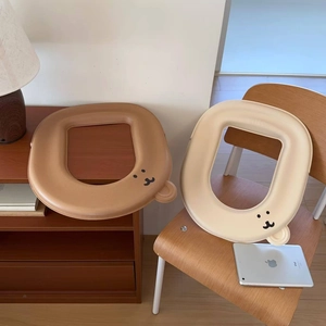 Close-up of waterproof EVA toilet seat covers with cute bear ears in brown and beige