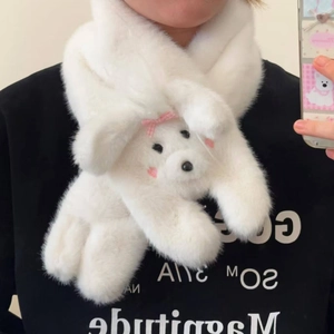 Detail of white plush scarf with a 3D cartoon bear head and pink checkered bow