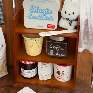 Macro detail of a 3-tier wooden desktop organizer shelf with rustic vintage finish