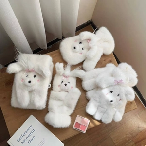 Cute white plush winter set with bear face design, including hat and gloves on wooden table