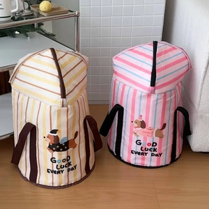 Macro detail of foldable laundry hampers with cartoon dog prints and sturdy handles
