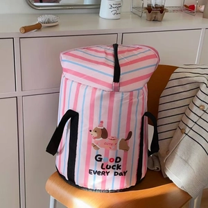 Detail of pink and blue striped folding foot soak tub with cartoon dog and top zipper
