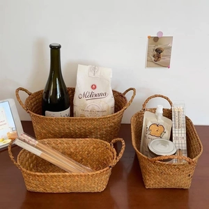 Three-piece set of natural woven storage baskets with handles for home organization