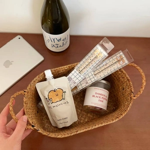 Close-up of woven storage basket featuring cute bear chopsticks and gourmet snacks