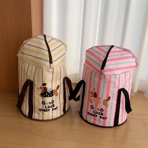 Detail of portable foot bath with zipper lid and cute cartoon dog patterns on fabric