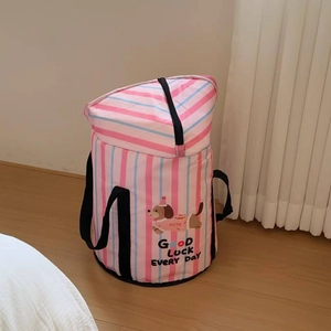 Detail of portable pink striped foot bath bag with cartoon puppy design and nylon handles