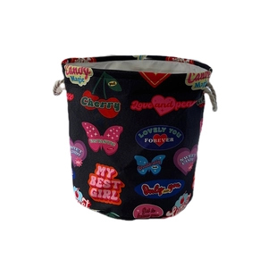 Large vintage black laundry basket with colorful heart prints and cotton rope handles