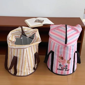 Detail of portable striped folding foot bath bags with drawstring and sturdy handles