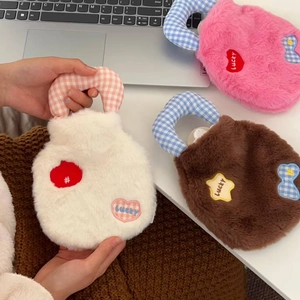 Three plush hot water bottle covers with lucky heart embroidery and checkered handles