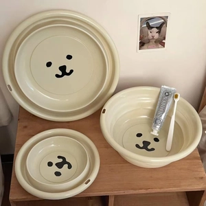 Three-piece set of beige foldable basins in different sizes with cute bear design