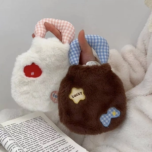Close-up of plush hot water bottles with Lucky star patches and checkered handles