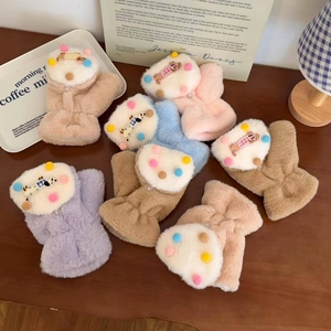 Detailed view of plush cartoon gloves in multiple colors with cute character dolls