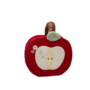 Cute red apple-shaped plush makeup bag with green leaf detail and top carry handle