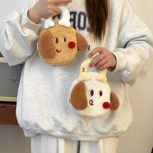 Detail of plush puppy hot water bottle bag with bone-shaped handle and soft furry texture