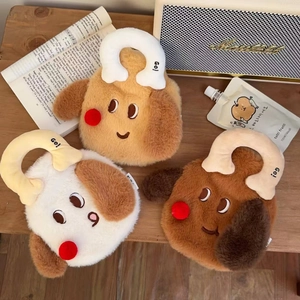 Three plush puppy hot water bags in khaki and brown on a dark wood table background