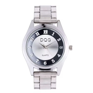 Detailed close-up of DQG quartz watch dial with silver sunray finish and steel band