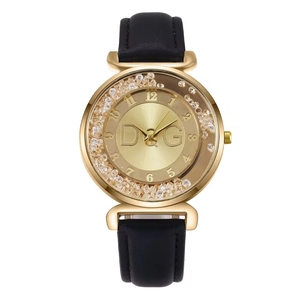 Orologio da donna alla moda con quadrante dorato e strass e cinturino in pelle nera