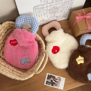 Detailed plush hot water bottle covers with lucky heart patches and woven handles
