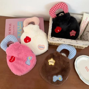 Detail of soft plush hot water bags with Lucky embroidery in four cute assorted colors