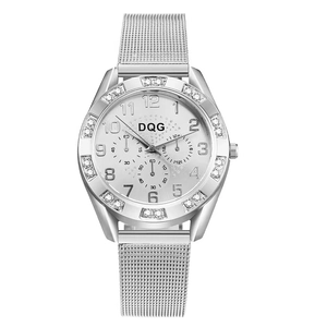Detailed macro of silver alloy mesh watch strap and crystal-studded bezel decoration