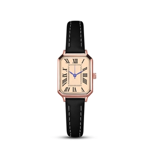 Macro detail of square rose gold watch with champagne dial and Roman numerals