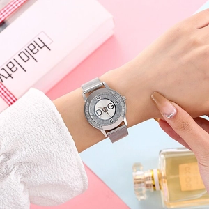 Detail of silver mesh strap watch with sparkling crystal bezel and D&G logo dial