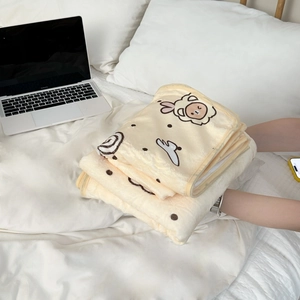 Detailed view of thick cream coral fleece blanket with cute sheep and polka dot pattern