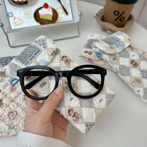 Quilted cotton sunglass pouch with cute bear and floral prints featuring resin button closure