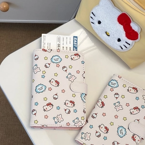 Detail view of cartoon cat theme multi-functional passport holder and plush storage bag