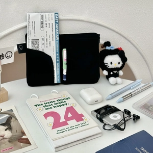 Close-up of black passport holder interior with slots for boarding passes and cards