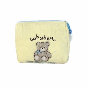 Quilted baby bear travel makeup bag with blue zipper and cute bear embroidery on yellow fabric