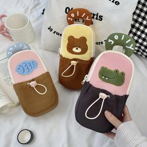 Three cute animal pencil cases featuring fish, bear, and crocodile motifs with handles