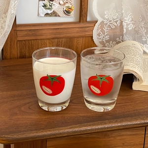 Ins-style tomato print transparent glass milk cups in a cozy home setting setup